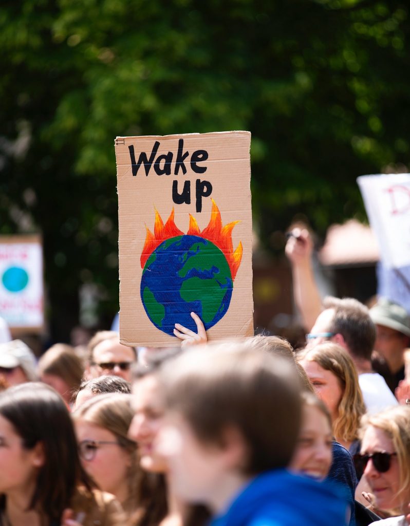 climate strike body image 1 - wake up the earth is on fire sign