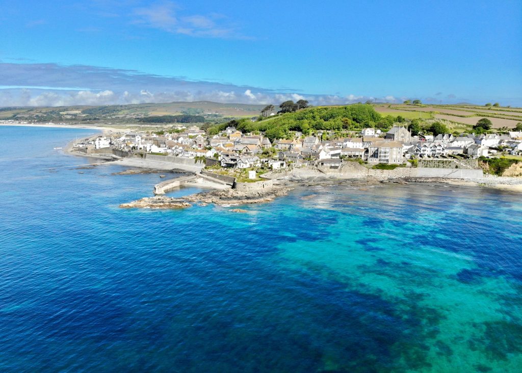 An image of a small village in Cornwall where the visitor economy changes the landscape every year