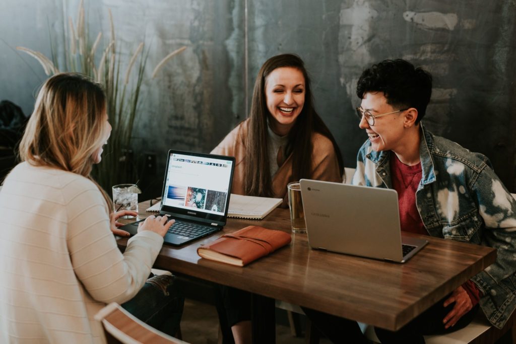 a picture of happy employees. As a business focusing on your staffs health and wellbeing is a crucial part of this united nations sustainable development goal