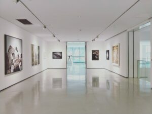 image of a museum displaying works of art. It is an open and quiet space.