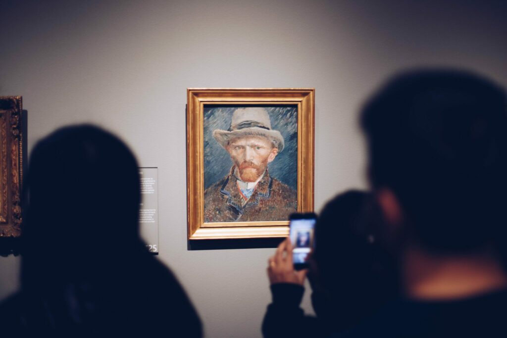 A group of people taking a photo at a museum.