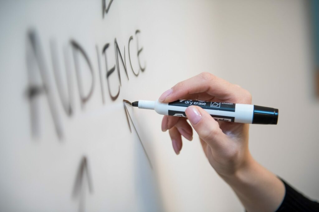 Audience is always the most important marketing trend and here we have someone directing lots of arrows at the word audience on a white-board